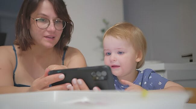 A Parent and Child Practicing Online Safety Measures