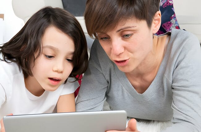 Concerned Parent and Child Engaged in a Meaningful Conversation About Online Safety